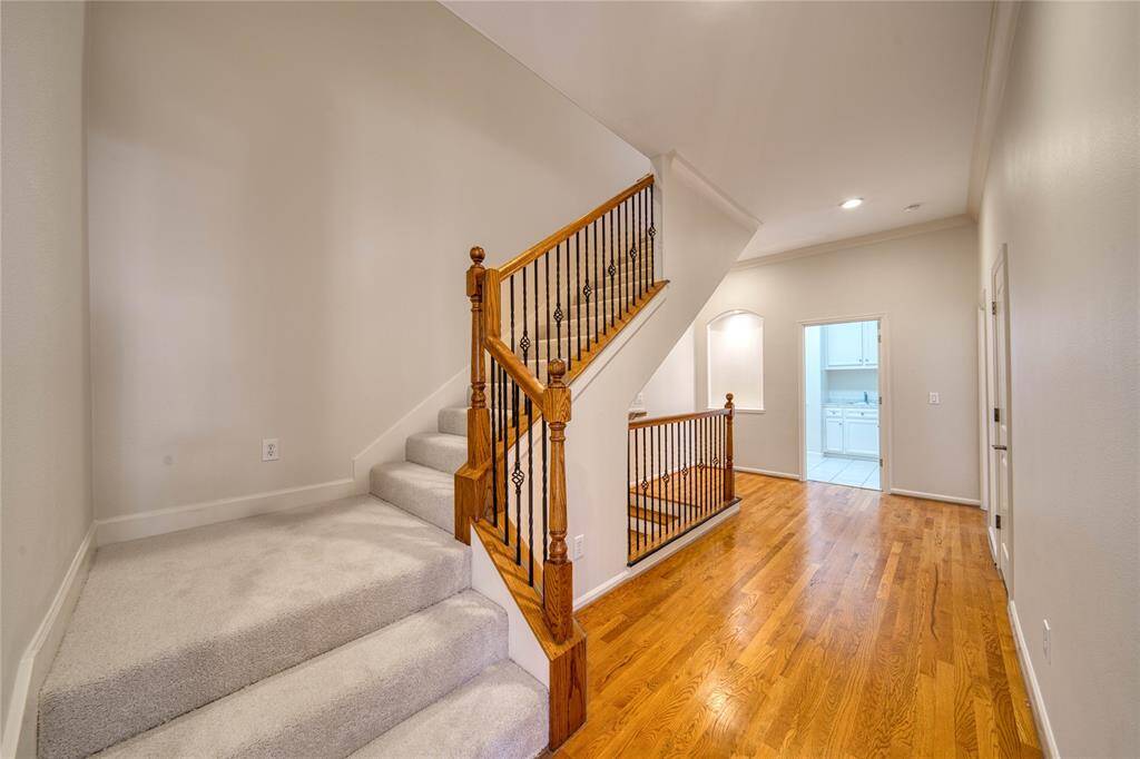 Lush, newly carpeted stairs leading to third floor flex space