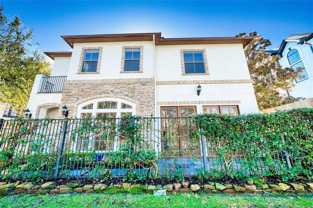 The freshly painted exterior and trim are beautifully complemented by elegant stone accents, adding timeless charm and sophistication to this exquisite home