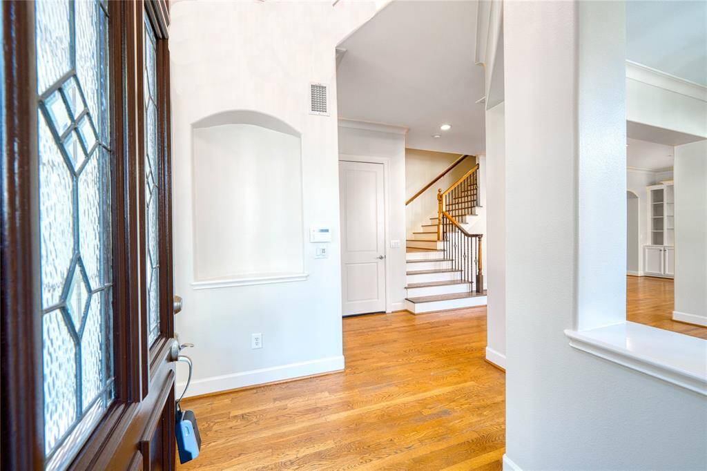 A welcoming entryway with plenty of space, perfect for creating a convenient mudroom to keep your home organized and stylis