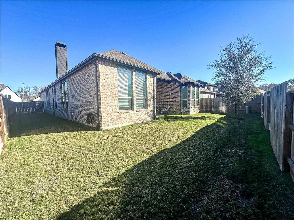 Amazing backyard shot of this gorgeous Highland Home situated on a corner lot on a quiet cul-de-sac street in the sought after community of Fulbrook on Fulshear Creek zoned to Lamar Consolidated ISD. Lush landscaping, well manicured backyard and a wonderful back covered patio. Perfect to set up an outdoor sitting area and enough room for a pool!
