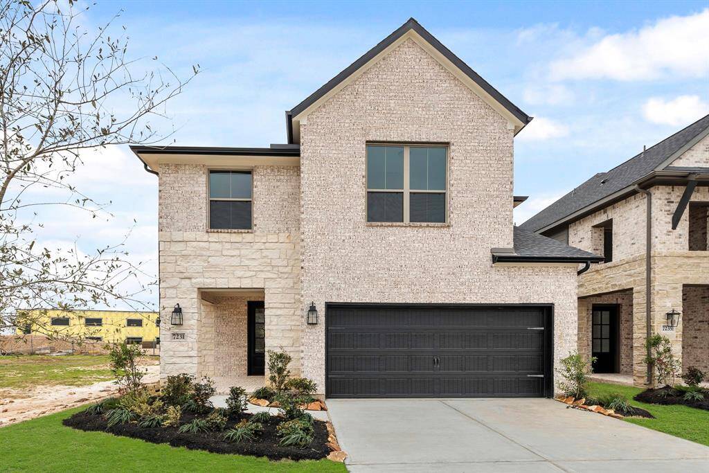 MOVE IN READY!! Westin Homes NEW Construction (Dominion, Elevation A) Two story. 4 bedrooms. 3.5 baths. Green grass added to enhance photo.