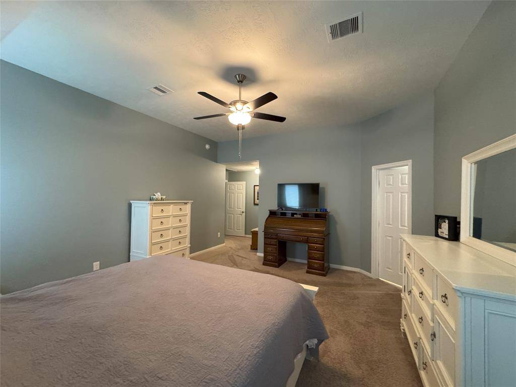 Another view of the primary bedroom.