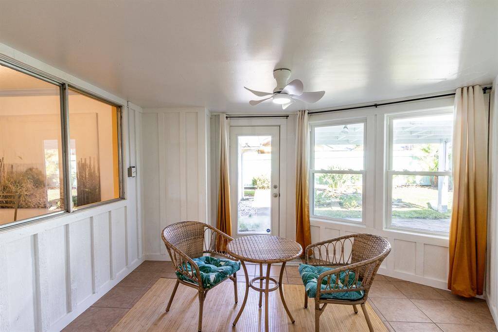The sunroom!  Covered patio and koi pond in the backyard.