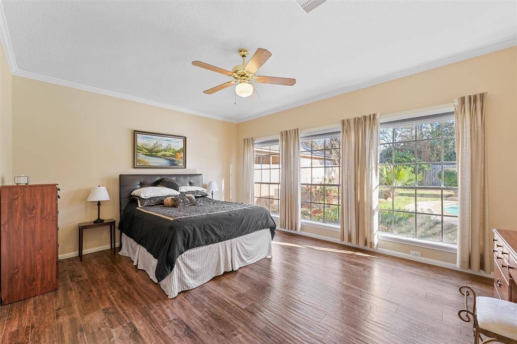 This primary bath has 2 walk-in closets, a frameless shower and a tub to relax in!
