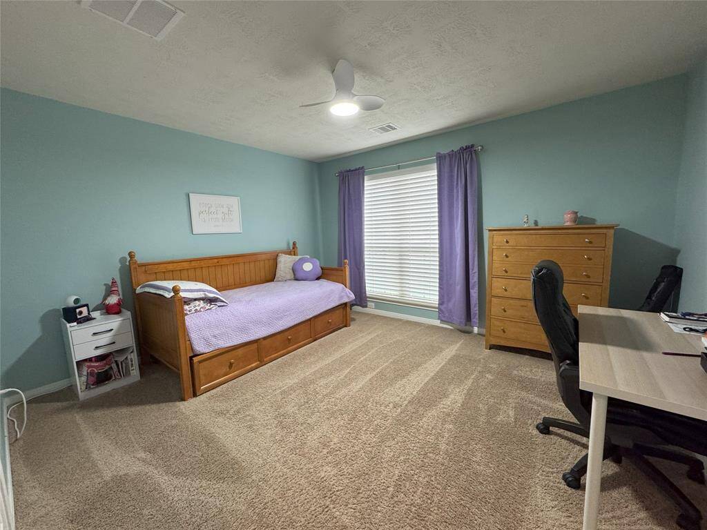 Third bedroom with ceiling fan.
