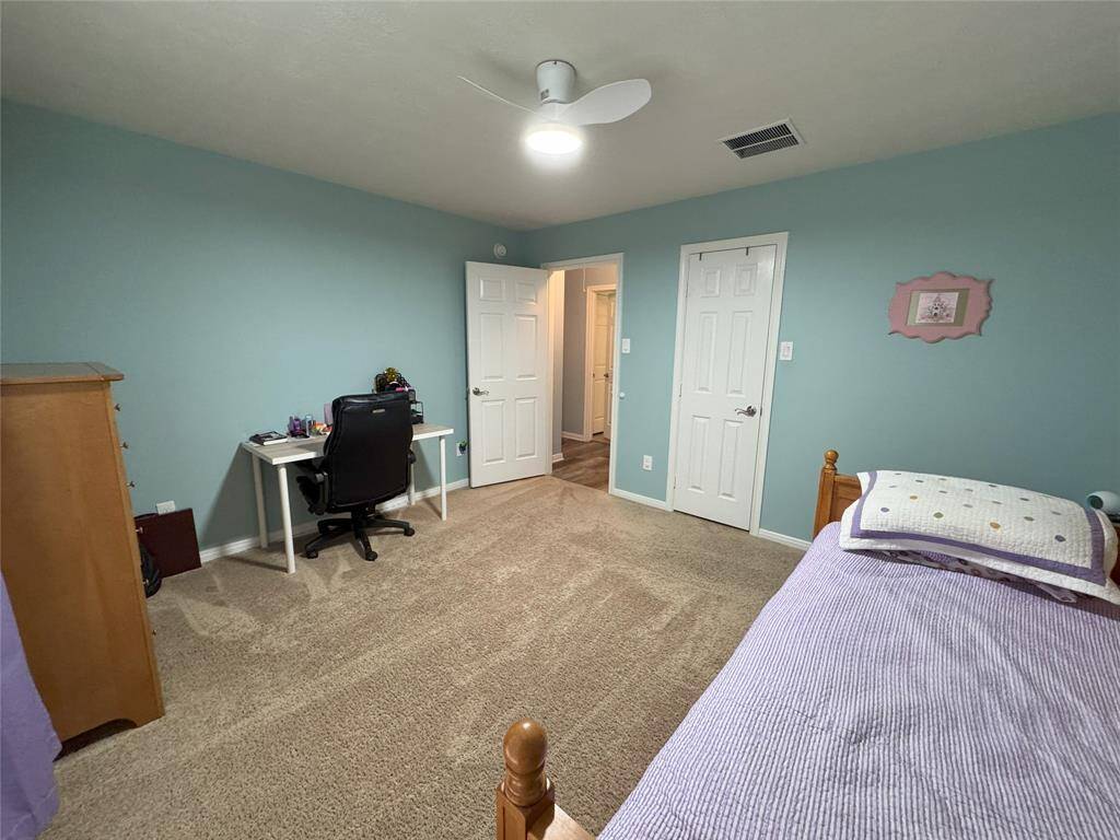 Third bedroom with walk in closet.