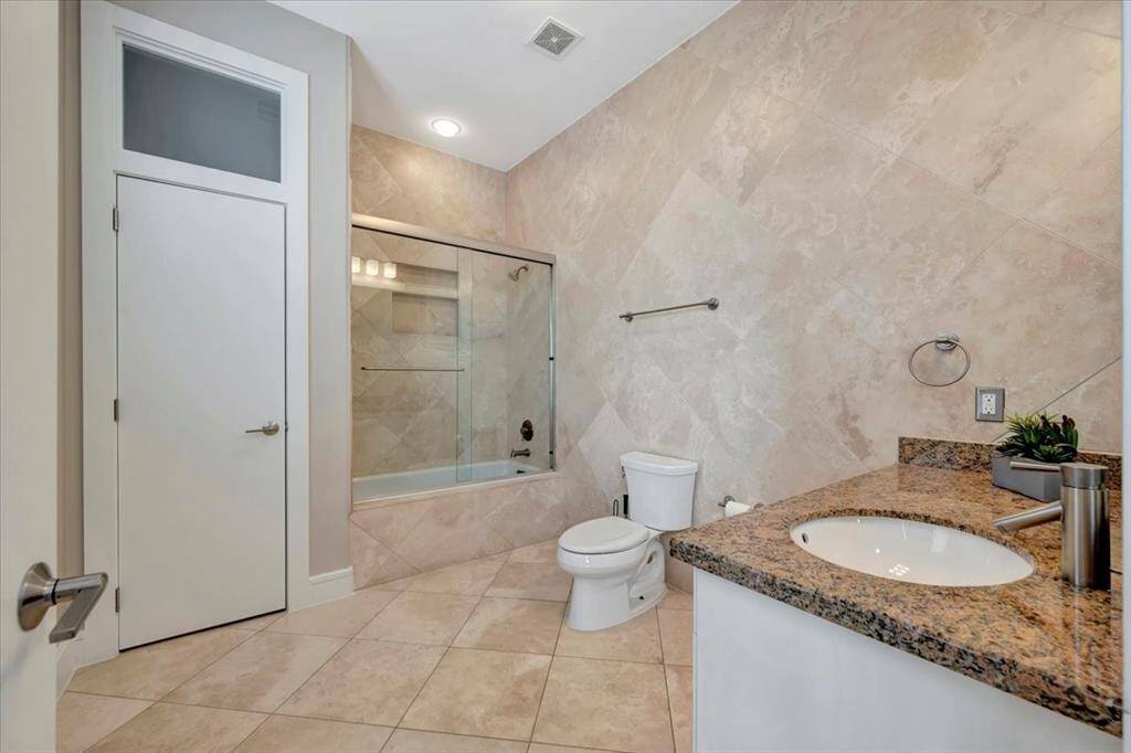 A dedicated built-in space designed to house electronics seamlessly, complete with ample room for a gigantic television, blending functionality with modern aesthetics