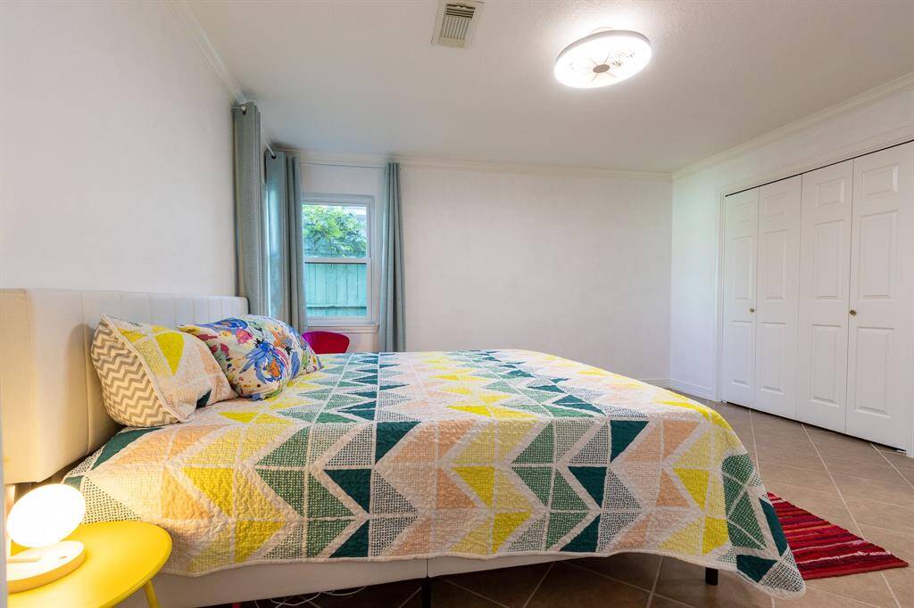 Large primary bedroom with closets to the right.