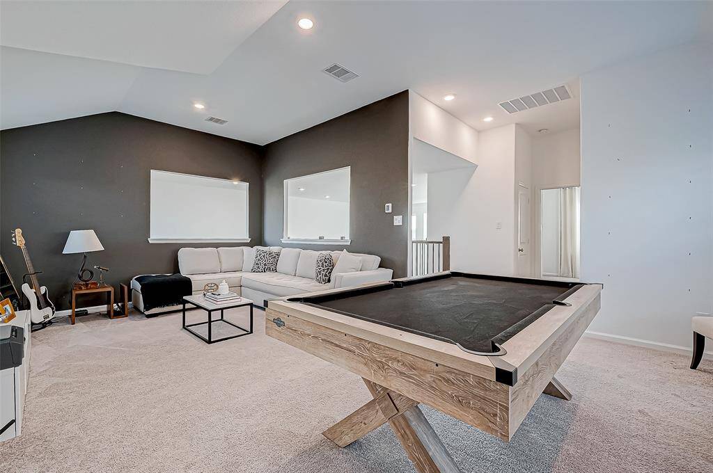 Another view of the spacious game room wit views to the first floor. Great space for everyone!