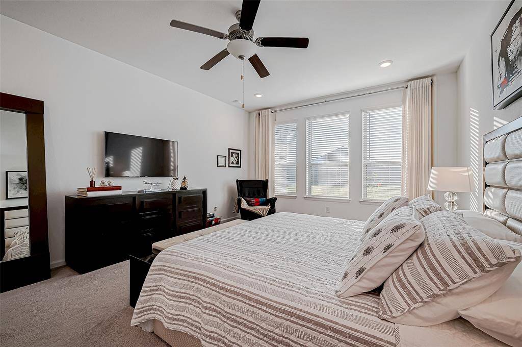 Primary Bedroom is located on the first floor. It offers great space for a complete design, carpet and great windows overlooking the backard.