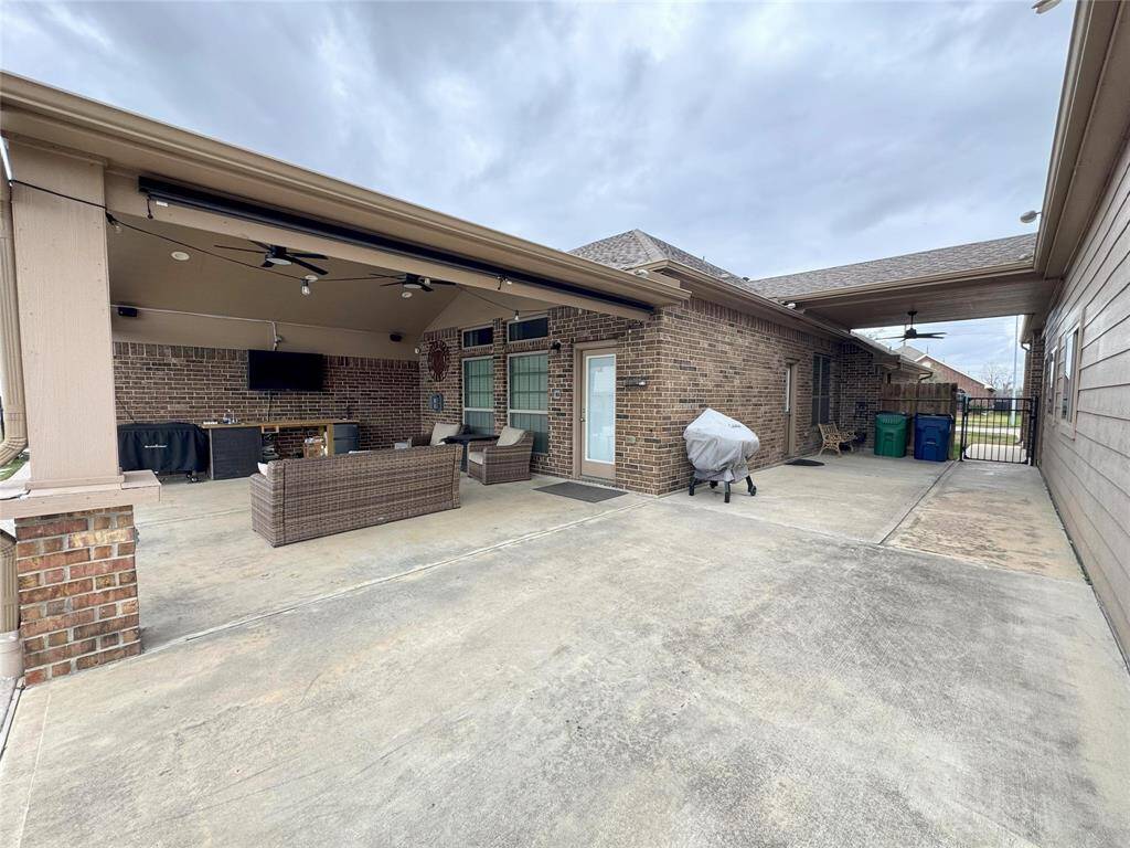 Custom patio covers out the back and side connecting to the garage.