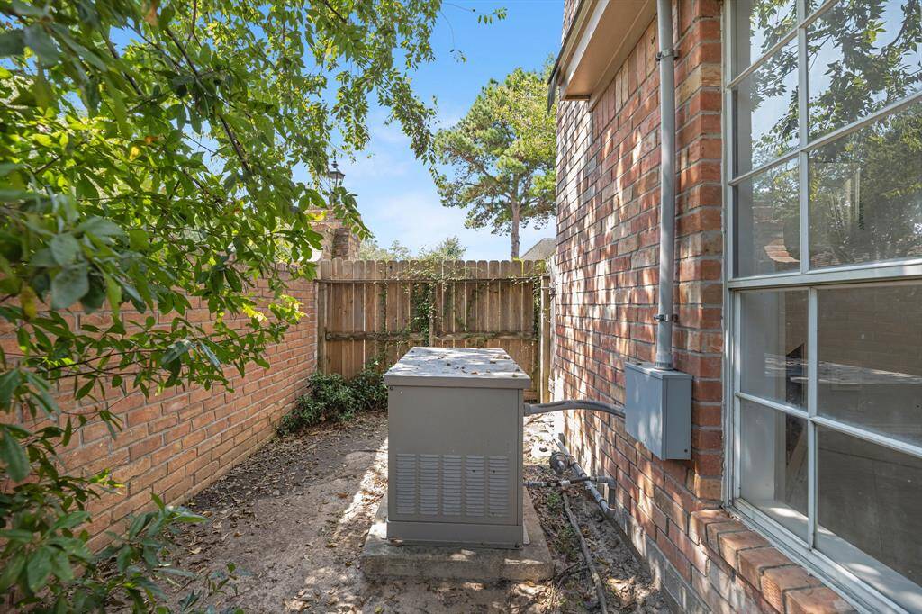 At the far end of the backyard, you will find a Kohler whole home generator!