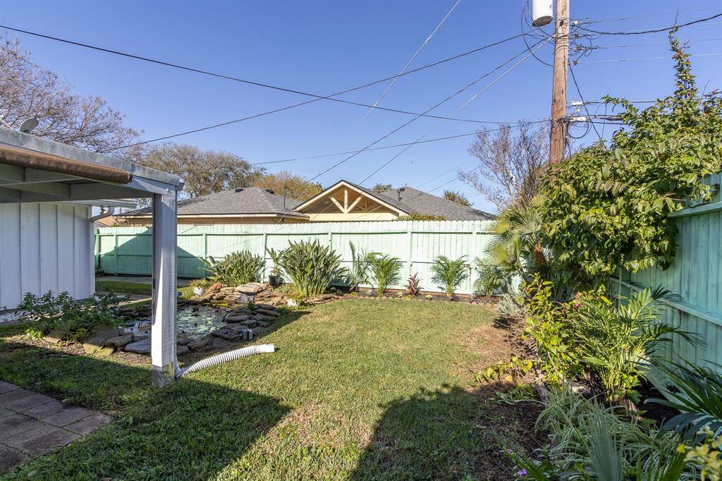Backyard space next to the koi pond/water feature.