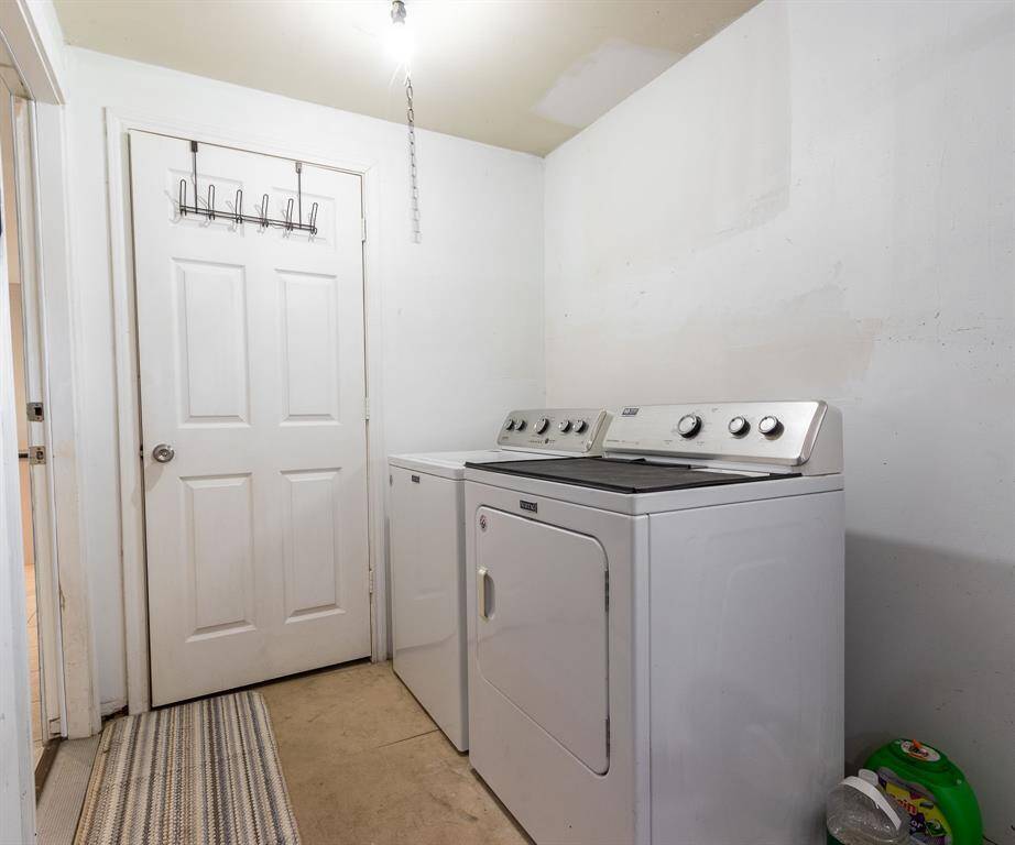 Washer & dryer with the breakfast room to the left and storage closet in the foreground.