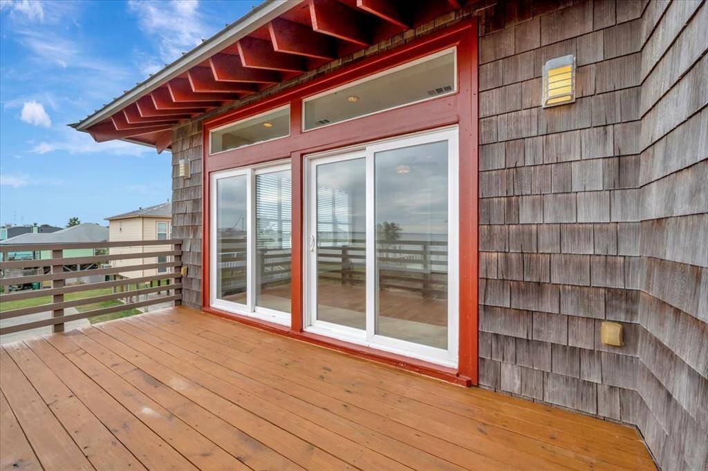 A stunning view unfolds through the sliding glass doors, where an open-concept space with rich wood floors seamlessly blends with the tranquil beauty of water vistas beyond.A stunning view unfolds through the sliding glass doors, where an open-concept space with rich hardwood floors seamlessly blends with the tranquil beauty of water vistas beyond.A stunning view unfolds through the sliding glass doors, where an open-concept space with rich hardwood floors seamlessly blends wit