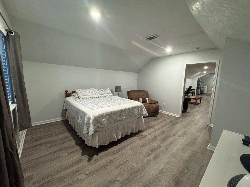 Garage apartment bedroom with barn door.