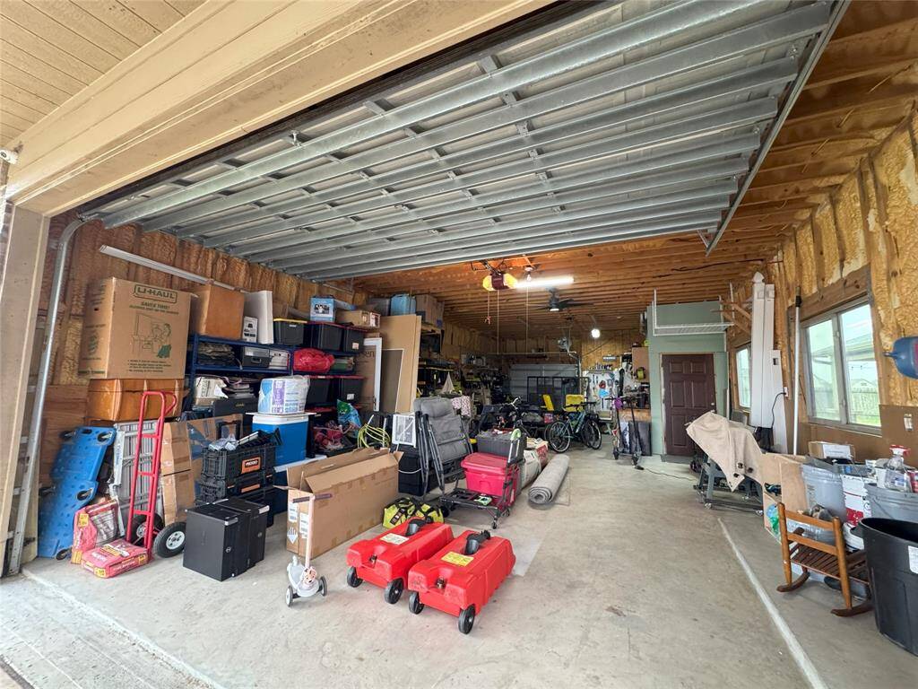Oversized garage with spray foam insulation and access to the apartment above.