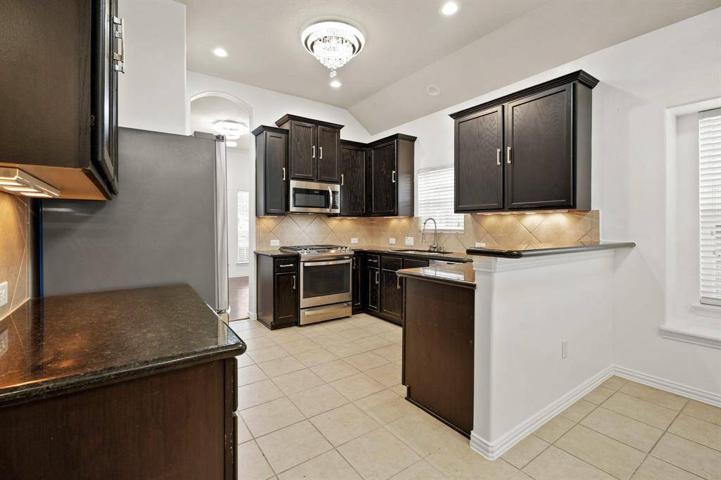 kitchen has all stainless appliances