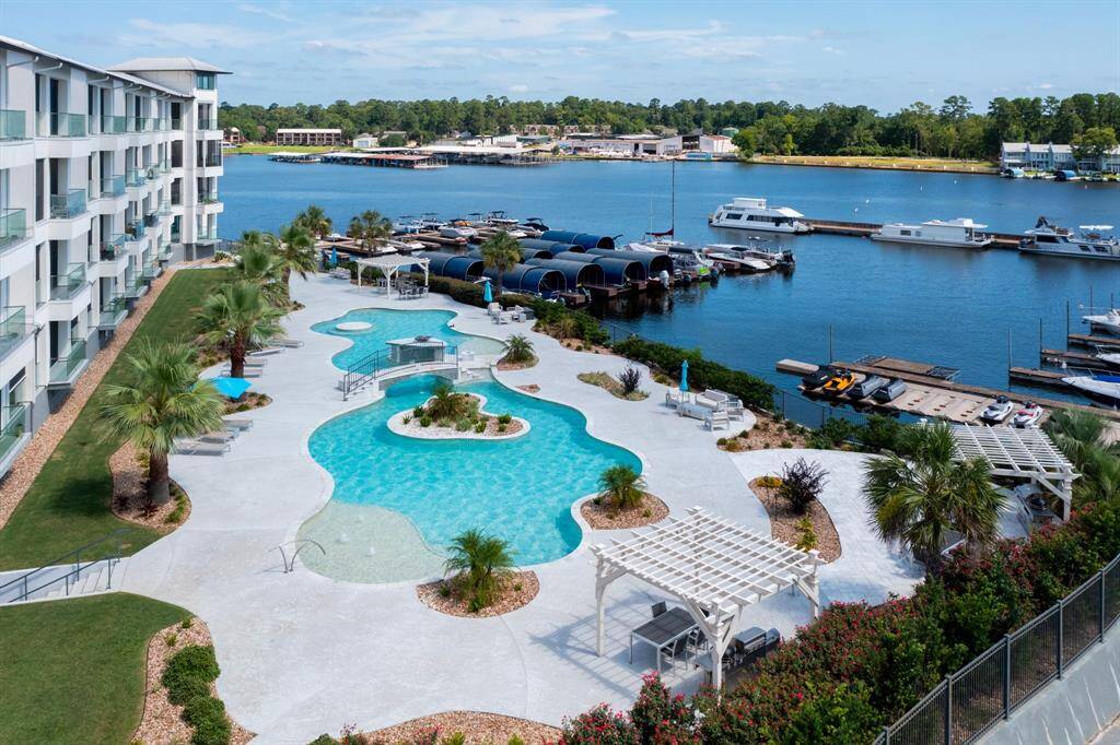 This is a waterfront property with a resort-style pool, offering direct access to marina facilities.