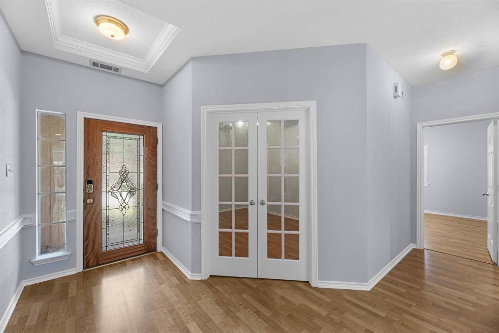 Beautiful leaded glass door provides an abundance of natural light.