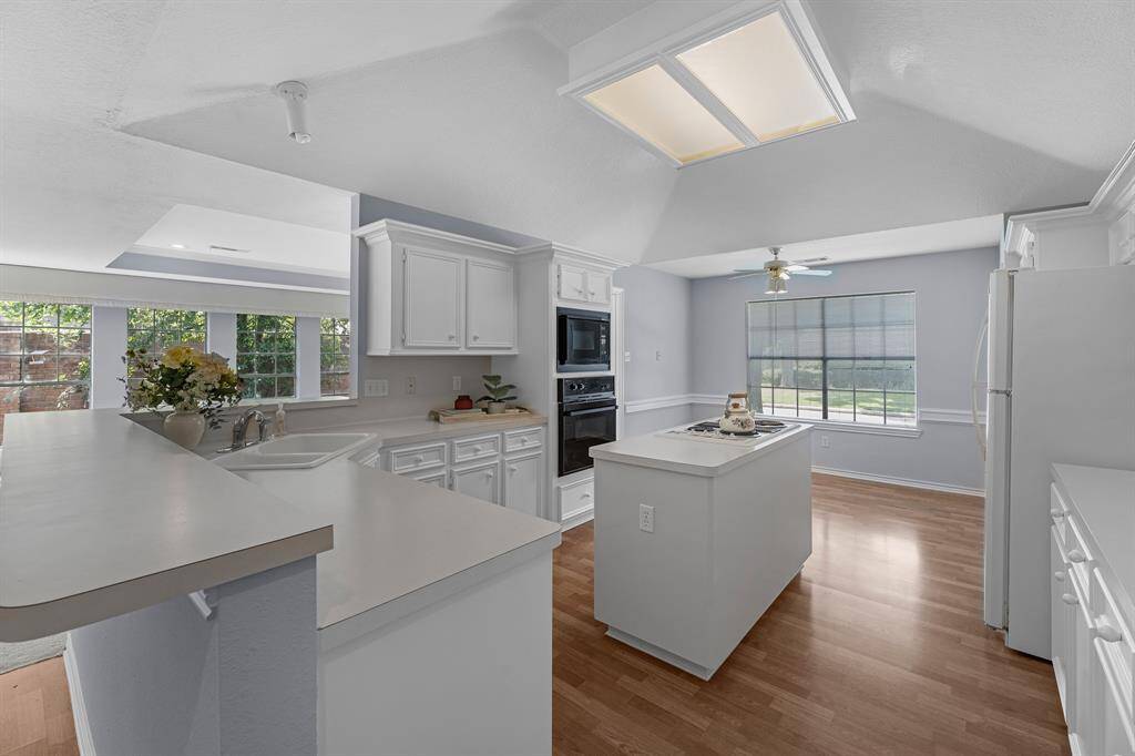 The massive kitchen has an eat-in breakfast room, which allos the chef to spend time with family and friends while whipping up a gourmet meal.