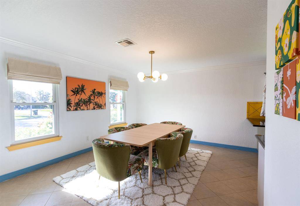 Formal dining room has an openness. Kitchen to the immediate right. Double-paned windows throughout the house.