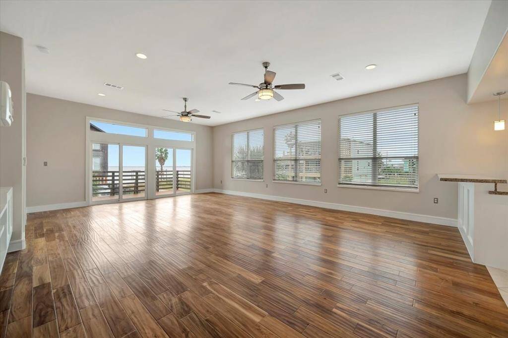 Design concept where large windows or glass doors create a seamless connection between indoor and outdoor spaces, allowing natural light, fresh air, and views to enhance an open-plan living area.