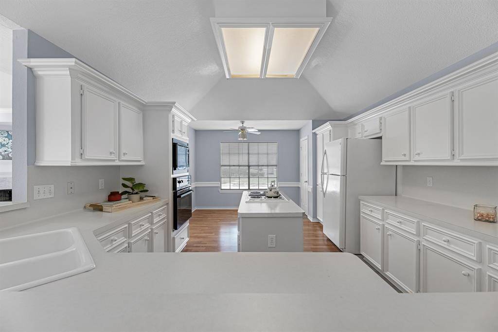 Another view of the kitchen. There is an abundance of storage and space.