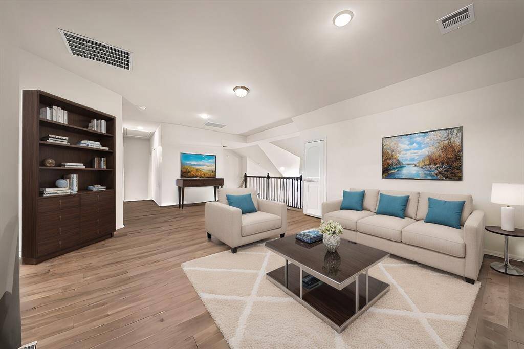 Gameroom upstairs with balcony (Virtually staged)