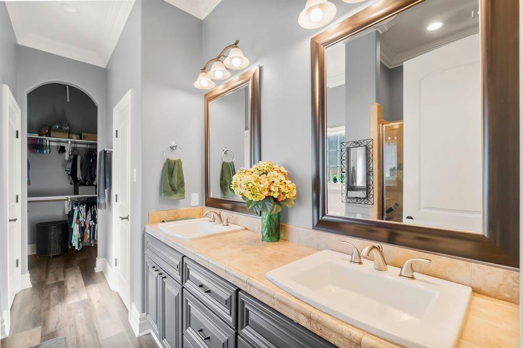 Another view of primary bath to closet area.