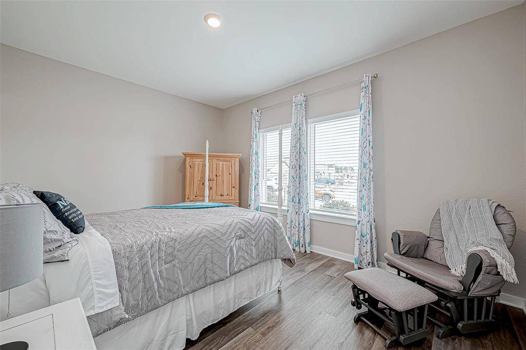 Secondary bedroom on the first floor in the front of the home.