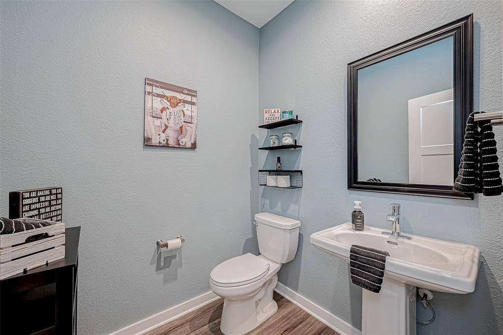 Half bathroom off the entry hall of home.