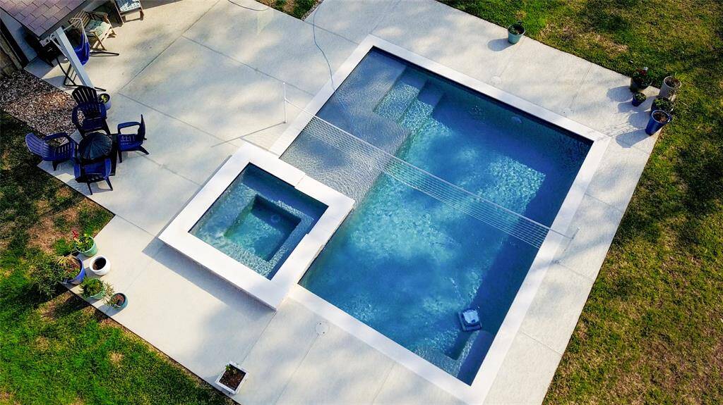 Experience the ultimate in summer entertainment with this heated sports pool, featuring a spa and customizable LED lights. Perfect for Texas Summer Lifestyle.