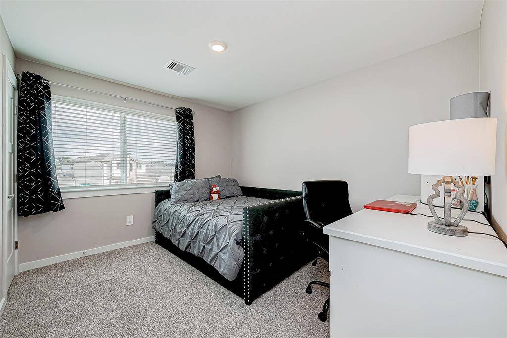 One of the three upstairs bedrooms.