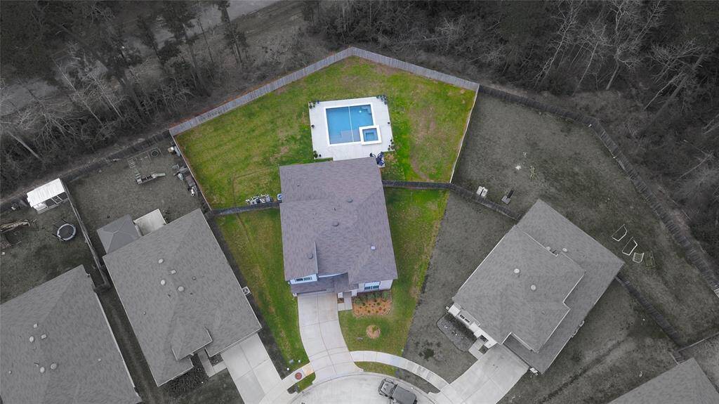 Expansive aerial view highlighting the home's generous size and private backyard with no rear neighbors.