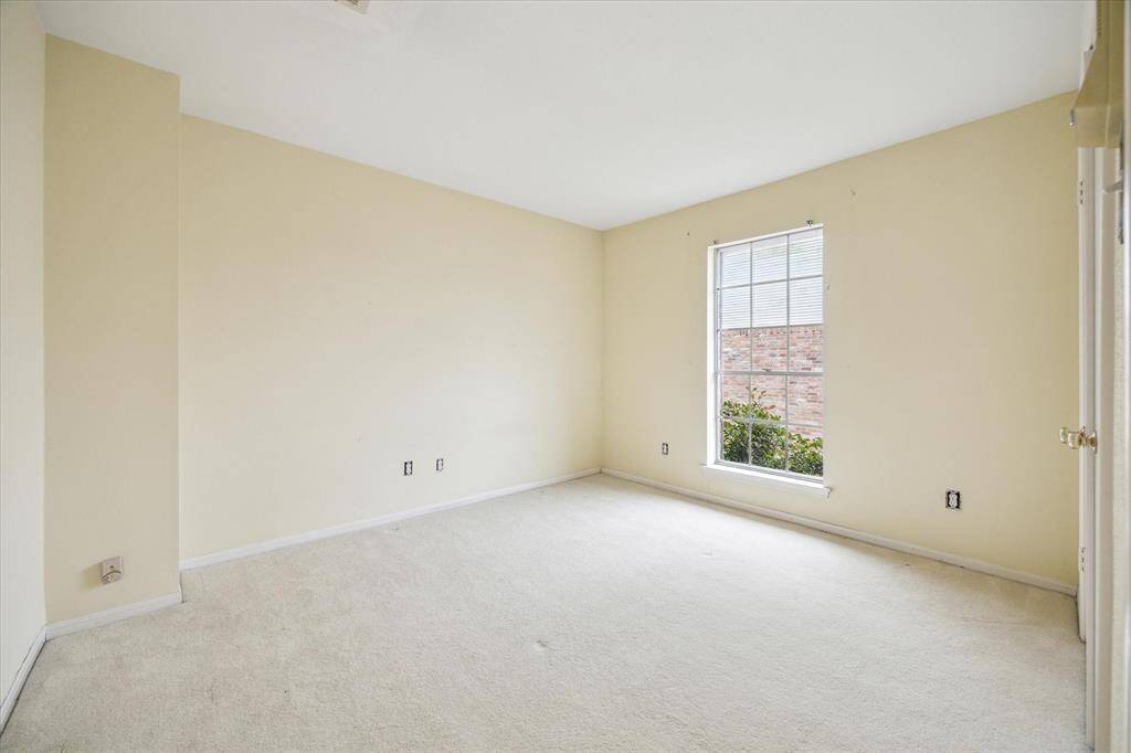 Generously-sized secondary bedroom, perfect for guests or a home office.