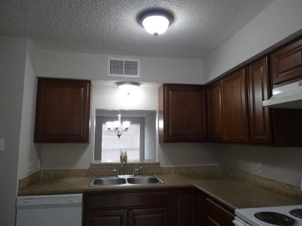 Granite Counters w/Back Splash, Beautiful Cabinets & Pass Through into Dining/Family Room Areas