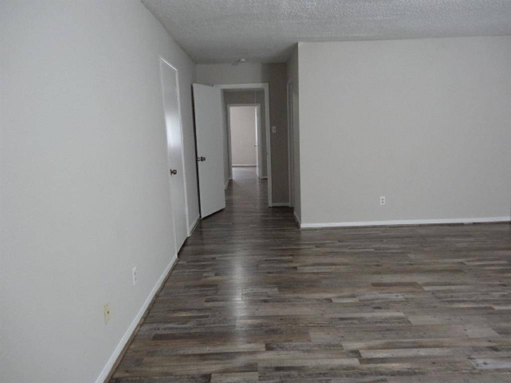 Inside the Spacious Primary Bedroom w/Glimpse of Secondary Bedrooms