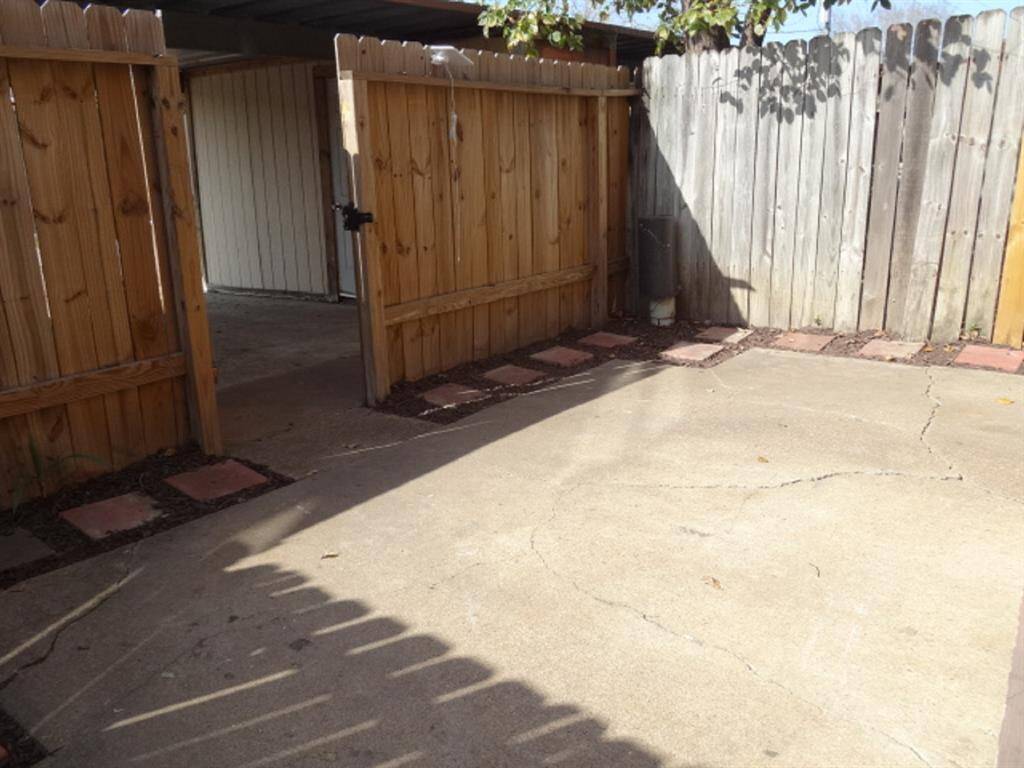 Gate Leading out to Covered Parking for 2 Autos