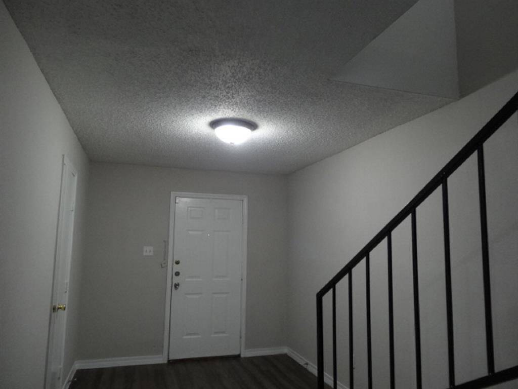 Bright, Roomy Entry w/Stairwell to the right & 1/2 Bathroom to the Left (unshown)