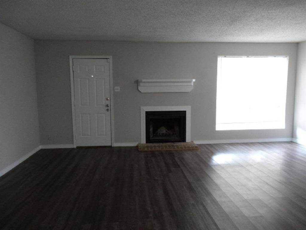 Family Room w/Fireplace and Laminate Floors