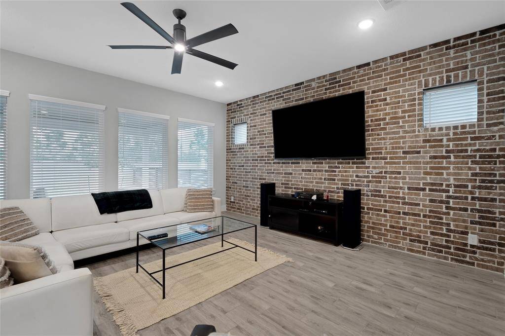Living room overlooks the backyard that has a huge comfortable covered patio area.