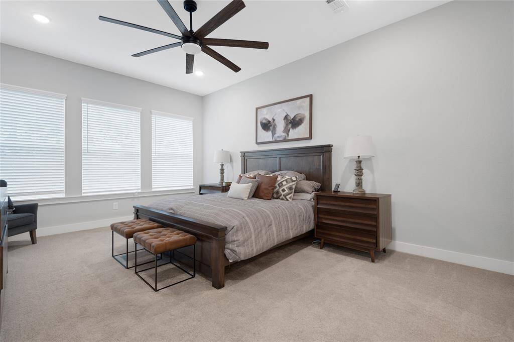 Primary suite has brand new carpet , incredible bathroom and closet and ck out that ceiling fan!