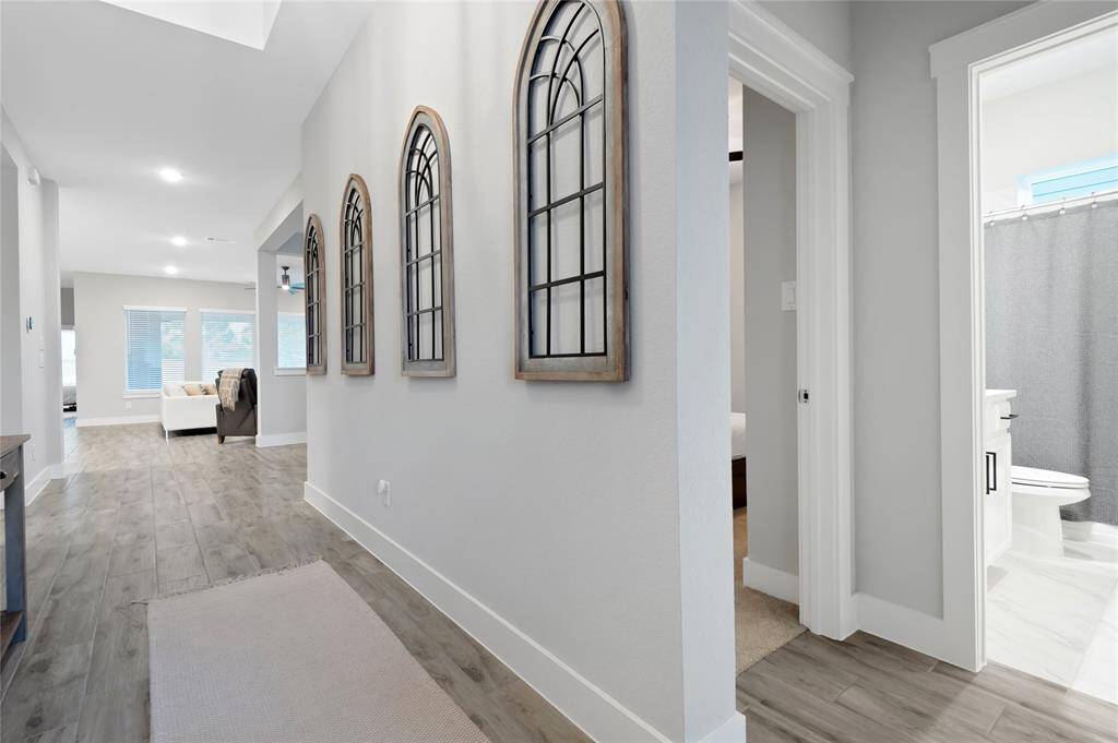 Split bedroom plan with the guest bedrooms in a separate section from the primary suite which ensures privacy.