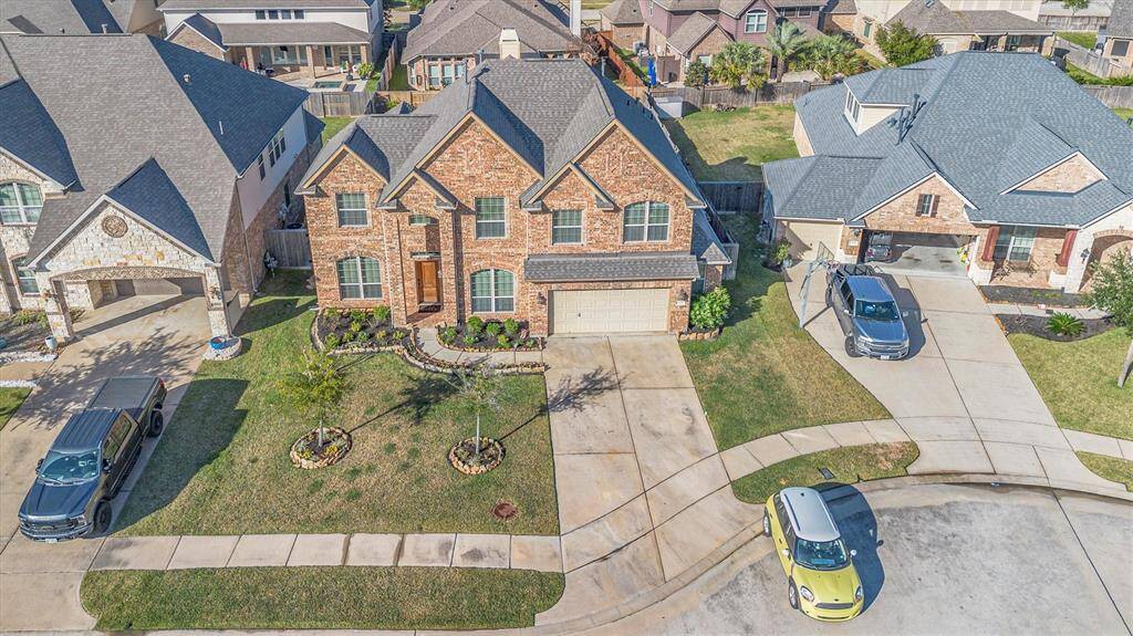 Welcome Home to this charming two-story brick home with a pristine front lawn and a spacious two-car garage, nestled in a serene suburban neighborhood.
