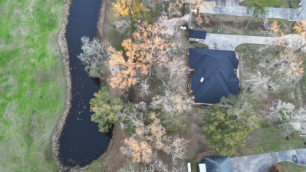 small pond sits at the edge of this property near the golf course