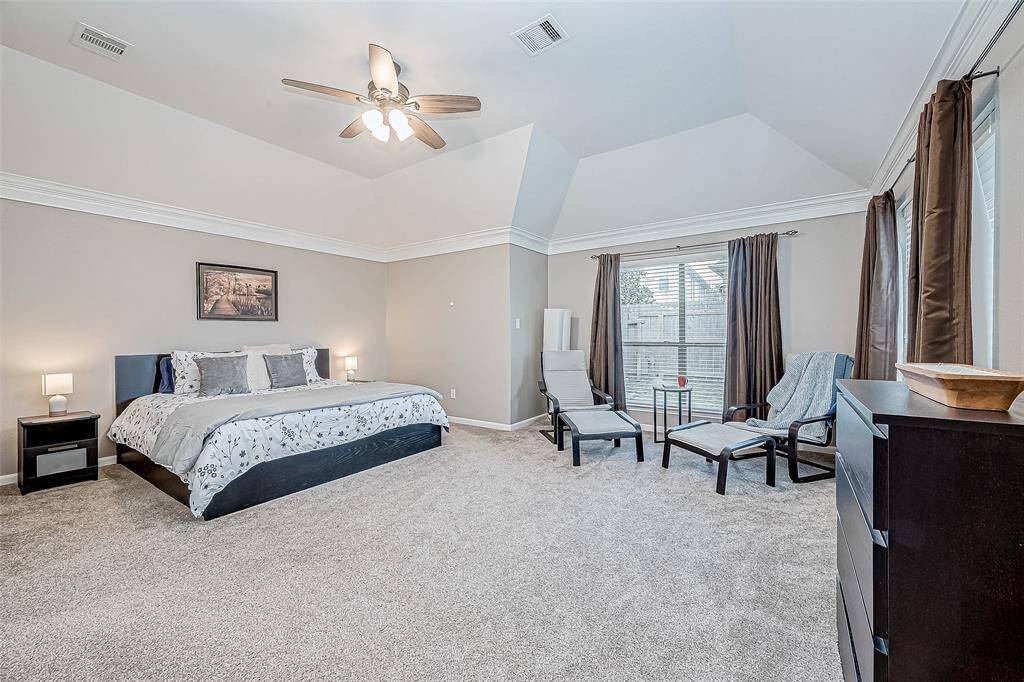 Primary Bedroom with plenty of space for reading nook or office space.