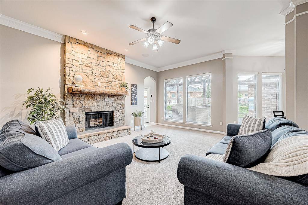 Open living room with large windows with a view of your stunning backyard.