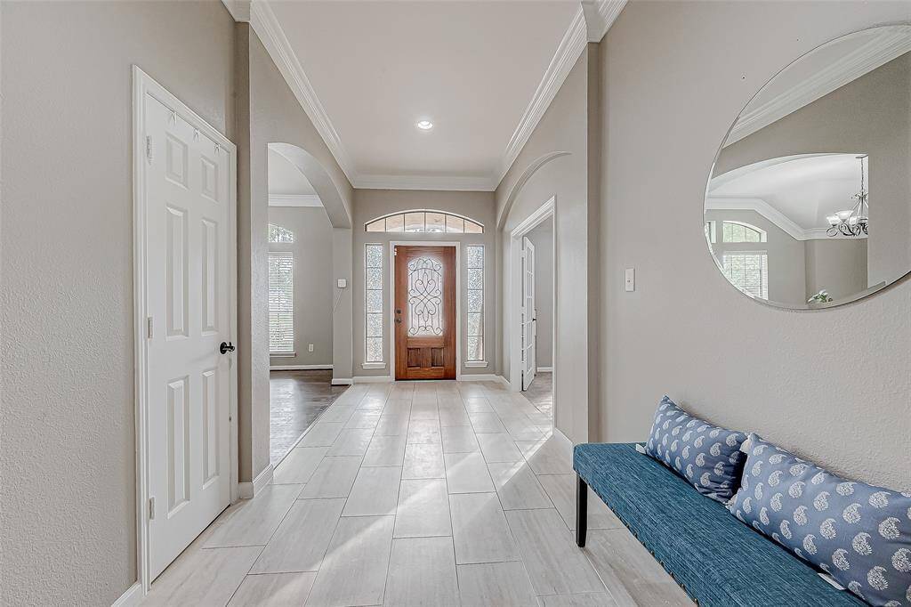 Long open hallway leading to open living.