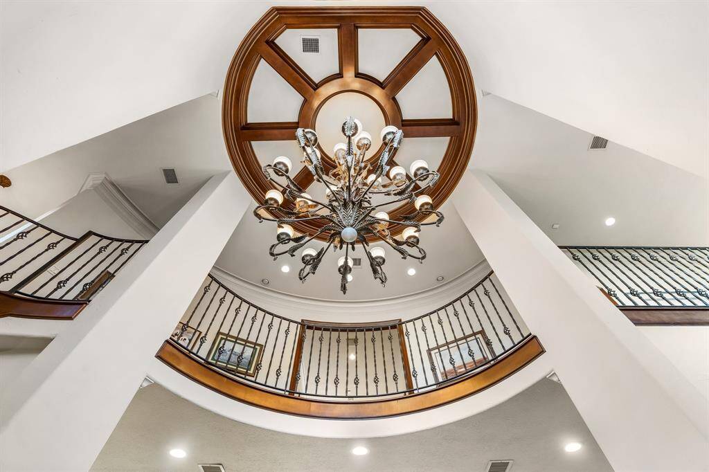 Stunning crane-operated chandelier adds elegance and functionality for easy maintenance.